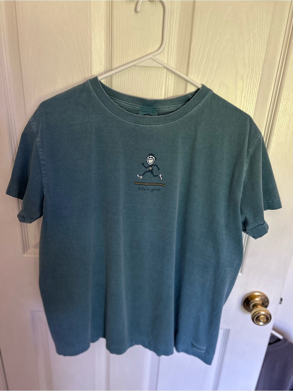 Life Is Good Woman’s teal Crewneck T-Shirt with Running Graphic